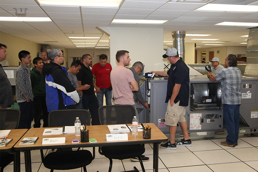 Class gathered around an economizer